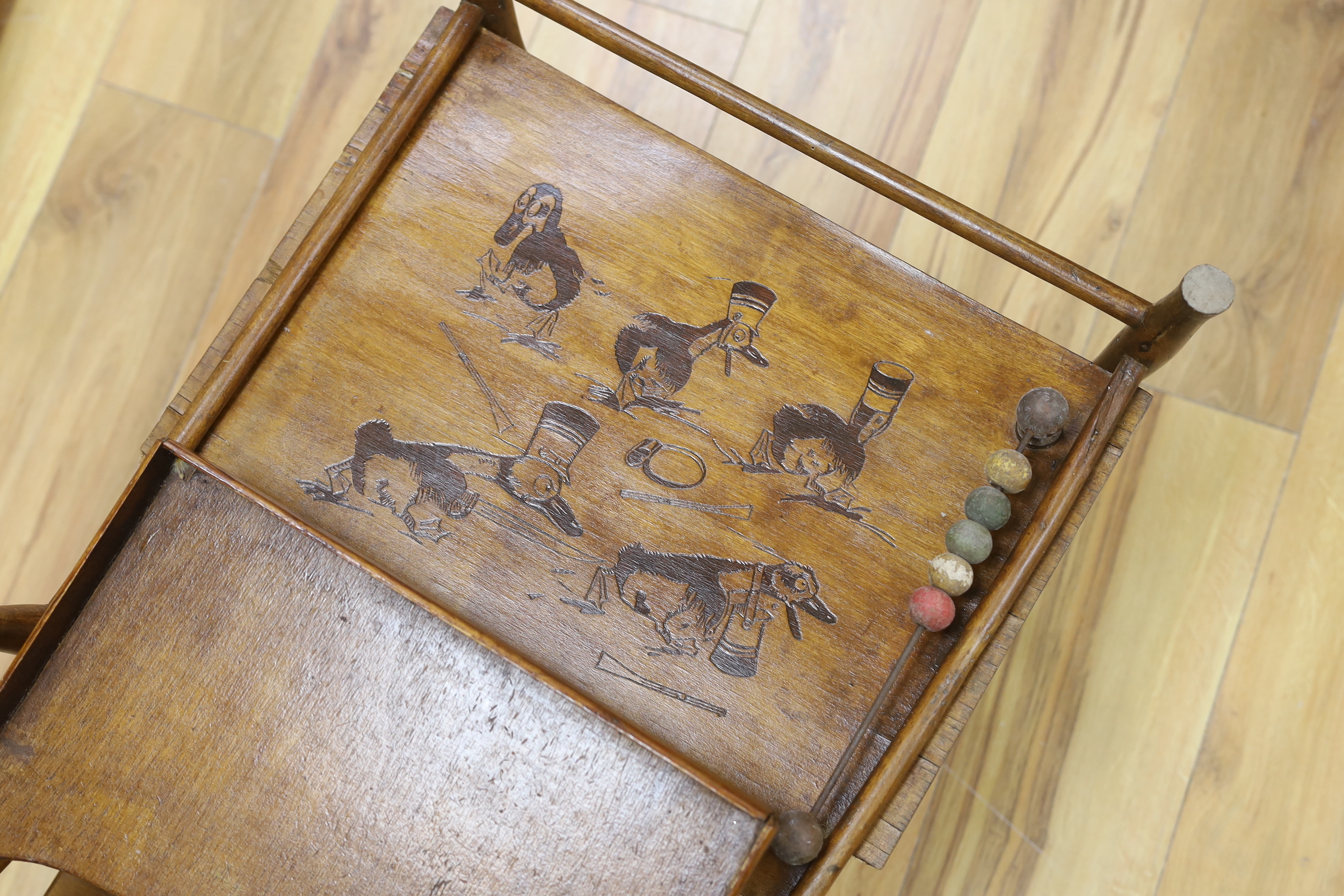 An Edwardian high chair / push chair